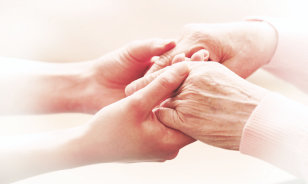 caregiver and senior woman smiling