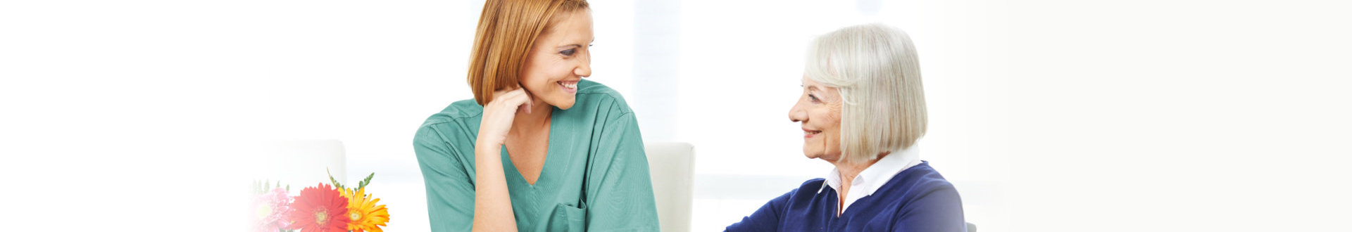 caregiver and senior woman talking
