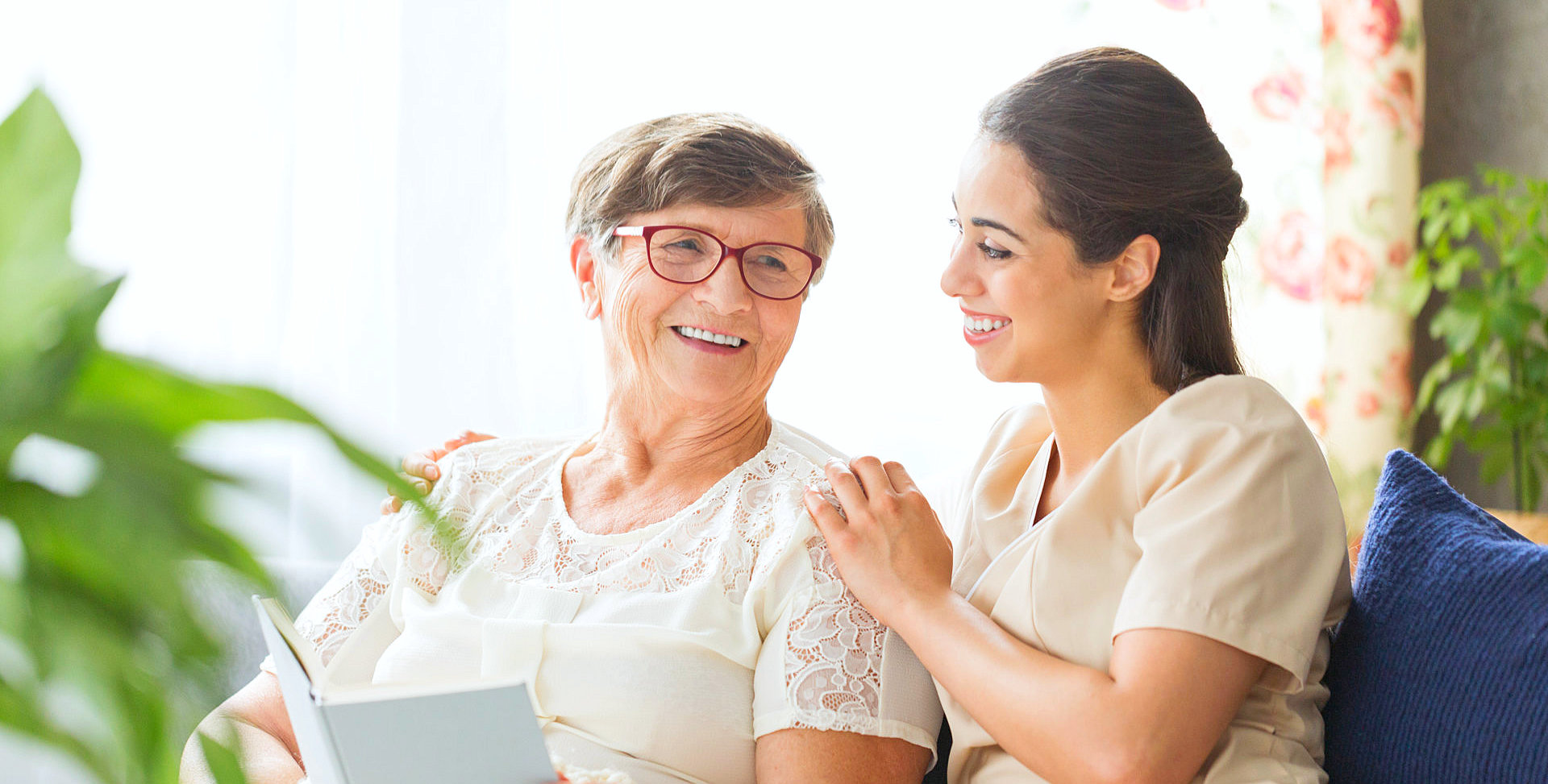 caregiver and senior woman smiling