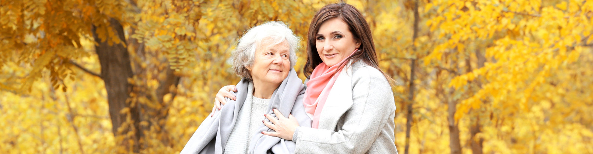 caregiver and senior woman smiling