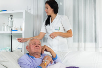 senior man receives infusion iv therapy