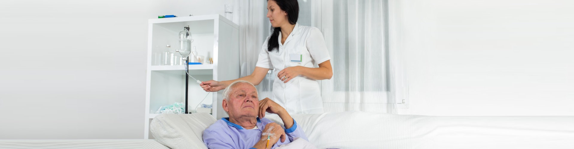 senior man receives infusion iv therapy
