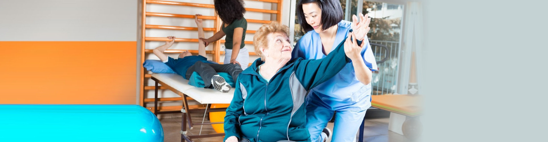 senior woman and woman exercising assisting with their occupational therapists
