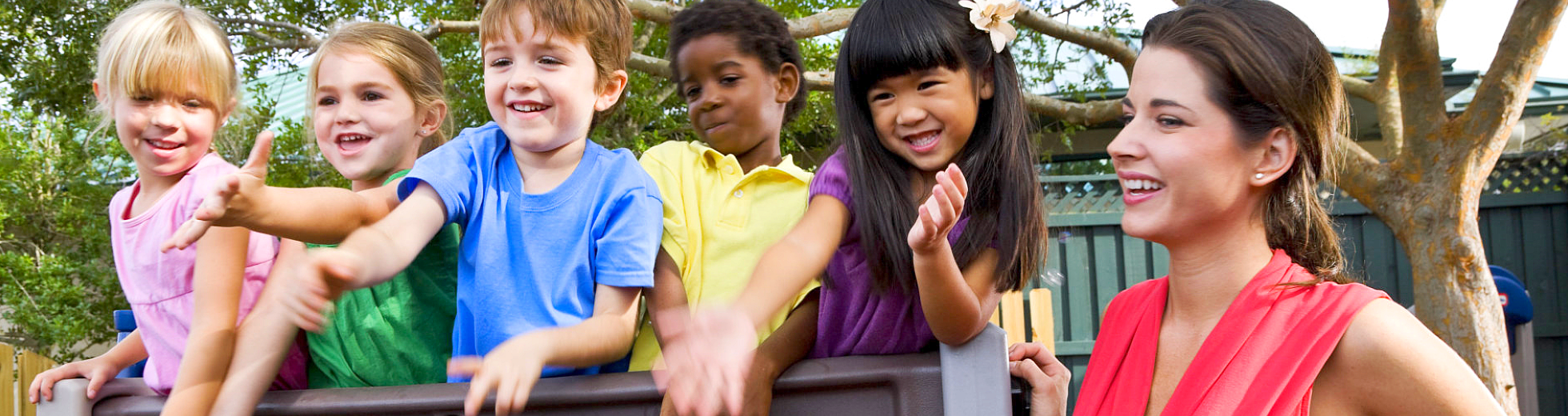 teacher playing with her students