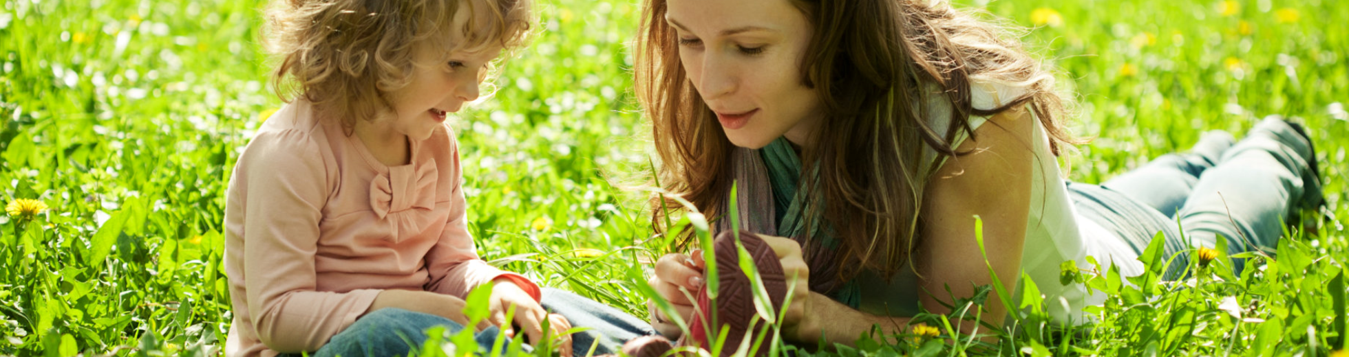 teacher teaching her student on how to read