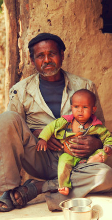 man carrying his child