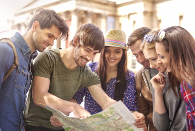 group of youth watching a map