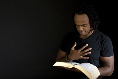 man reading a bible