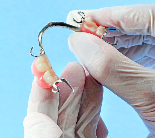 Dentist hand with medical rubber glove