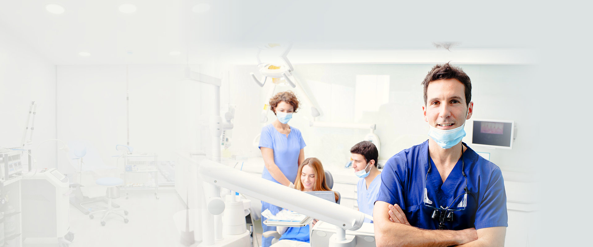 A portrait of a dentist with his team