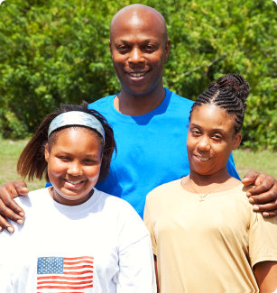 three people smiling